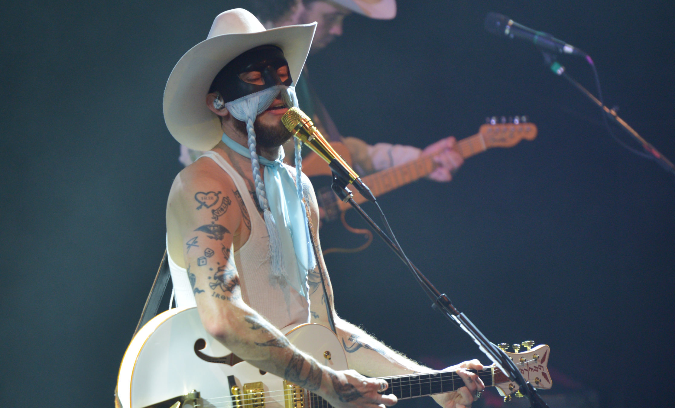 Masked Canadian country singer Orville Peck charmed in his return to